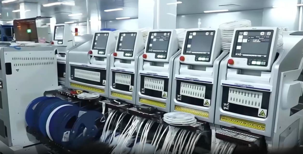 Row of SMT pick-and-place machines in the woCyber electronics facility